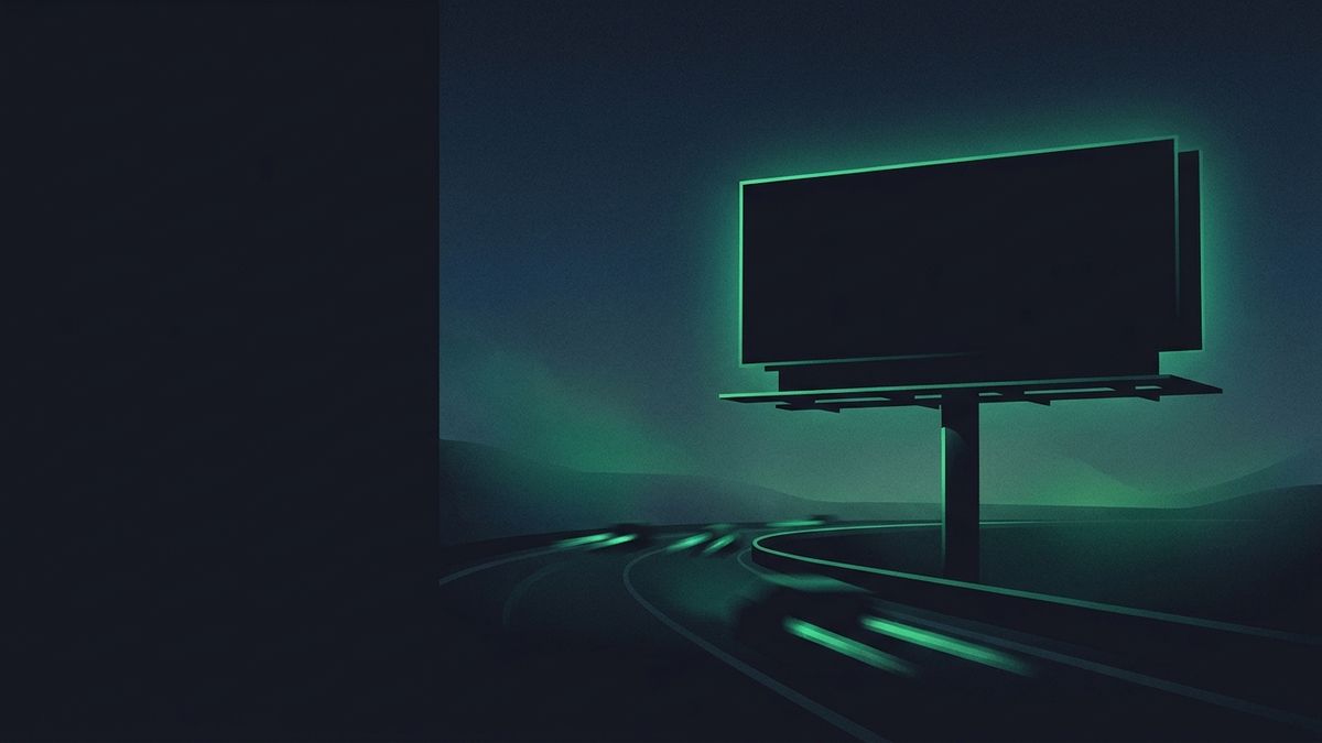 A roadside billboard glowing at dusk, illustrating competing with billboard firms